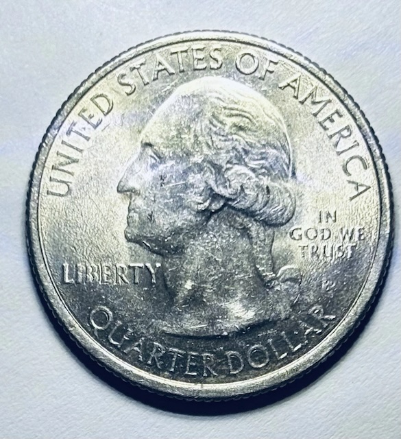 2012 quarter off-center strike error showing design shifted significantly from center with blank planchet crescent visible